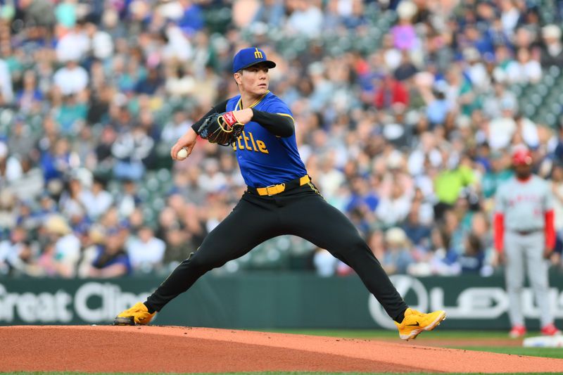 May 31, 2024; Seattle, Washington, USA; Seattle Mariners starting pitcher Bryan Woo (22) pitches to the Los Angeles Angels during the first inning at T-Mobile Park. Mandatory Credit: Steven Bisig-USA TODAY Sports