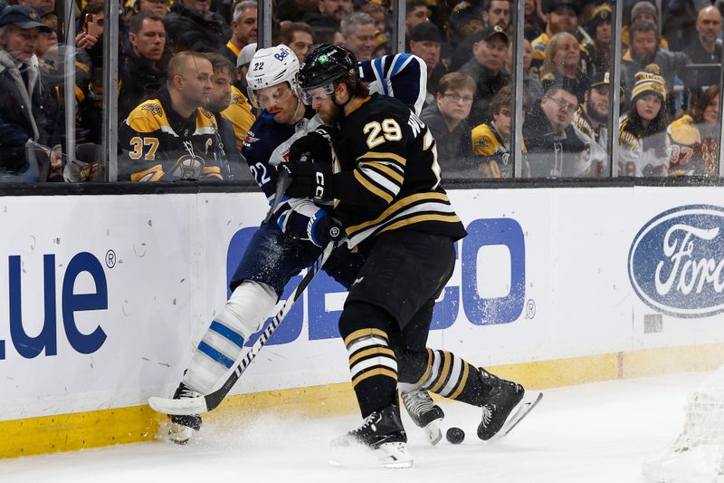 Jan 22, 2024; Boston, Massachusetts, USA; Boston Bruins defenseman Parker Wotherspoon (29) tries to hold Winnipeg Jets center Mason Appleton (22) off the puck during the first period at TD Garden. Mandatory Credit: Winslow Townson-USA TODAY Sports