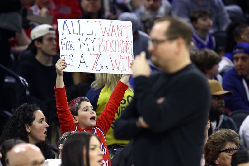 PHILADELPHIA, PENNSYLVANIA - MARCH 06: A fan displays a sign during the first quarter of a game between the Philadelphia 76ers and the Memphis Grizzlies at the Wells Fargo Center on March 06, 2024 in Philadelphia, Pennsylvania. NOTE TO USER: User expressly acknowledges and agrees that, by downloading and or using this photograph, User is consenting to the terms and conditions of the Getty Images License Agreement.  (Photo by Tim Nwachukwu/Getty Images)