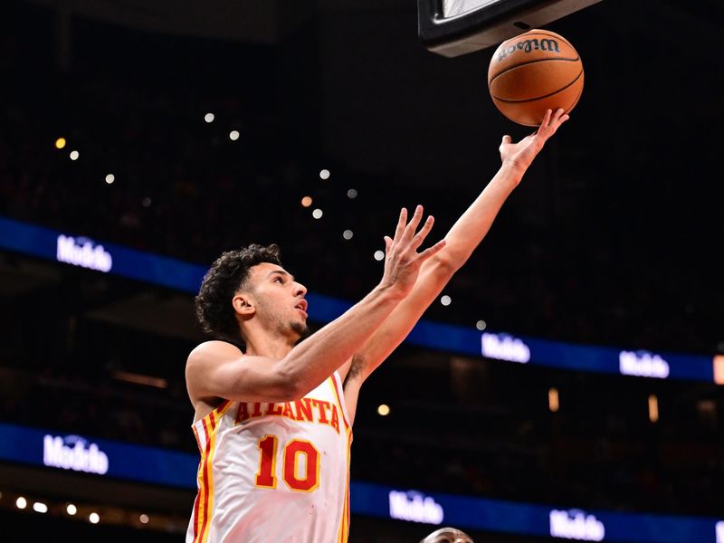 ATLANTA, GA - FEBRUARY 24: Zaccharie Risacher #10 of the Atlanta Hawks shoots the ball during the game against the Miami Heat  on February 24, 2025 at State Farm Arena in Atlanta, Georgia.  NOTE TO USER: User expressly acknowledges and agrees that, by downloading and/or using this Photograph, user is consenting to the terms and conditions of the Getty Images License Agreement. Mandatory Copyright Notice: Copyright 2025 NBAE (Photo by Adam Hagy/NBAE via Getty Images)