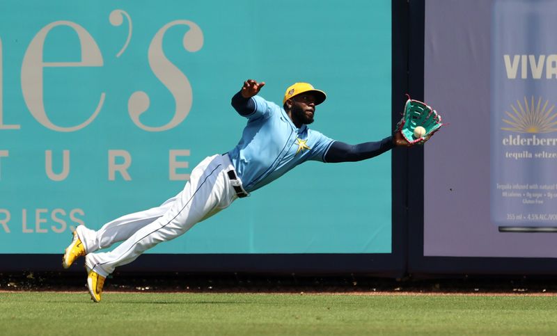 Mar 18, 2024; Port Charlotte, Florida, USA; Tampa Bay Rays outfielder Randy Arozarena (56)  catches a fly ball during the third inning against the Atlanta Braves  at Charlotte Sports Park. Mandatory Credit: Kim Klement Neitzel-USA TODAY Sports