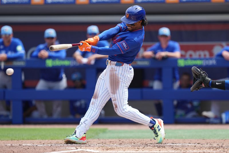 Mar 15, 2026; Port St. Lucie, Florida, USA;  New York Mets shortstop Francisco Lindor (12) hits a single in the third inning against the Toronto Blue Jays at Clover Park. Mandatory Credit: Jim Rassol-Imagn Images