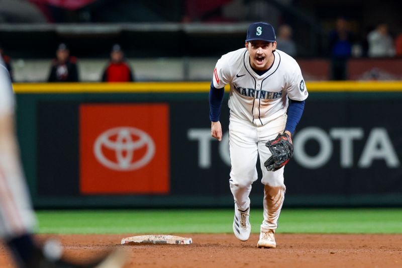 May 31, 2025; Seattle, Washington, USA; Seattle Mariners second baseman Cole Young (2) reacts after turning a double play against the Minnesota Twins to end the top of the tenth inning at T-Mobile Park. Mandatory Credit: Joe Nicholson-Imagn Images