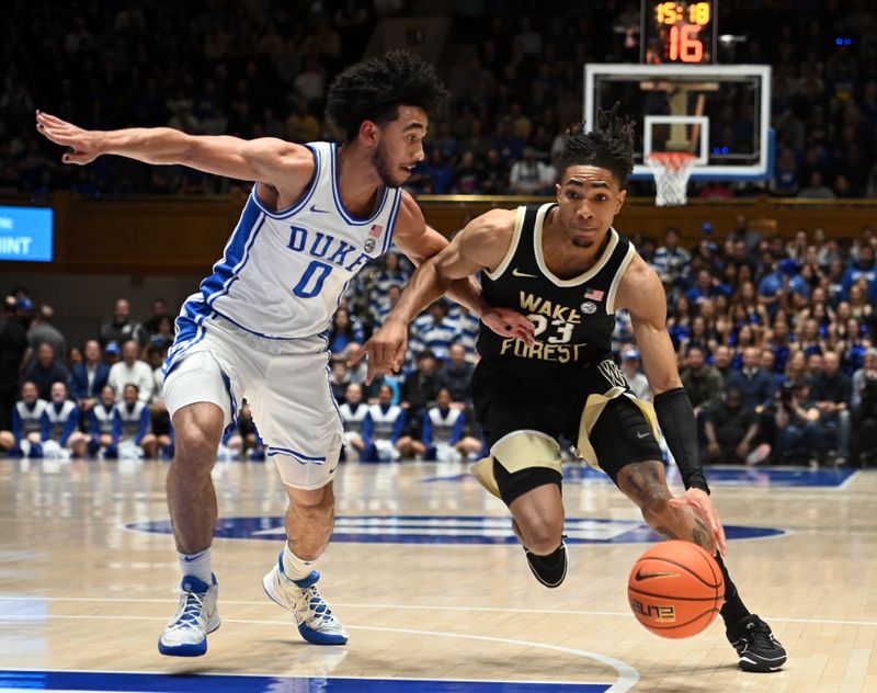 Feb 12, 2024; Durham, North Carolina, USA;  Wake Forest Deamon Deacons guard Hunter Sallis (23) drives to the basket as Duke Blue Devils guard Jared McCain (0) defends during the first half at Cameron Indoor Stadium. Mandatory Credit: Rob Kinnan-USA TODAY Sports