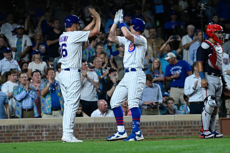 Jul 17, 2023; Chicago, Illinois, USA;  Chicago Cubs third baseman Patrick Wisdom (16) and Chicago Cubs first baseman Trey Mancini (36) high five after scoring on Wisdom   s two-run home run during the seventh inning against the Washington Nationals at Wrigley Field. Mandatory Credit: Matt Marton-USA TODAY Sports