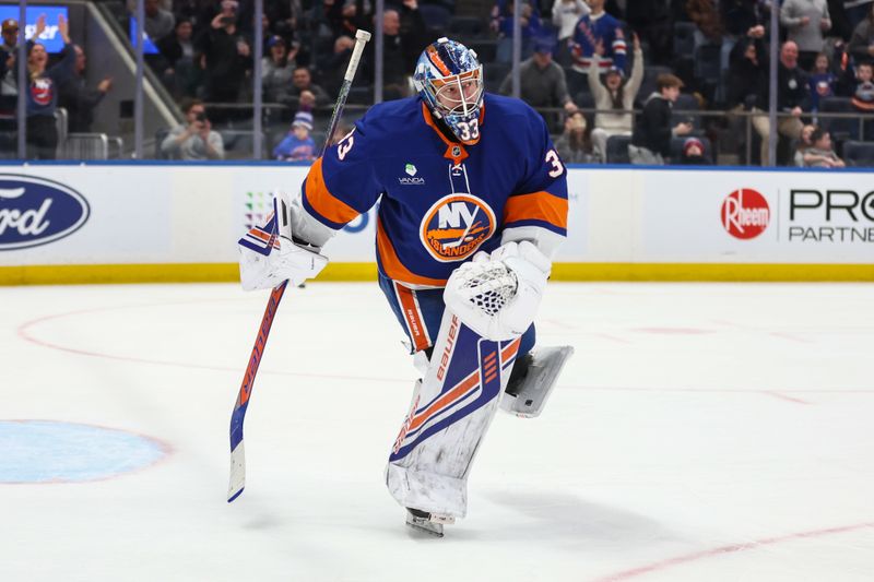 Dec 27, 2025; Elmont, New York, USA;  New York Islanders goaltender David Rittich (33) skates away from the net after making save on penalty shot on goal attempt in the third period against the New York Rangers at UBS Arena. Mandatory Credit: Wendell Cruz-Imagn Images