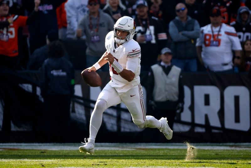 Arizona Cardinals quarterback Clayton Tune (15) runs with the ball during an NFL football game against the Cleveland Browns, Sunday, Nov. 5, 2023, in Cleveland. (AP Photo/Kirk Irwin)