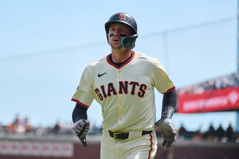 Apr 10, 2024; San Francisco, California, USA; San Francisco Giants shortstop Nick Ahmed (16) returns to the dugout after scoring a run against the Washington Nationals during the fifth inning at Oracle Park. Mandatory Credit: Robert Edwards-USA TODAY Sports