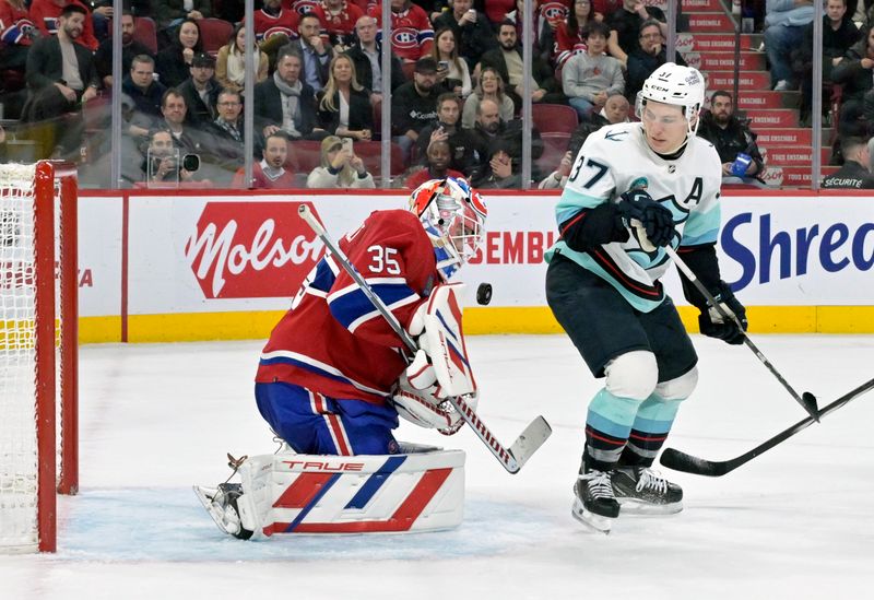 Dec 4, 2023; Montreal, Quebec, CAN; Montreal Canadiens goalie Sam Montembeault (35) makes a save in front of Seattle Kraken forward Yanni Gourde (37) during the third period at the Bell Centre. Mandatory Credit: Eric Bolte-USA TODAY Sports