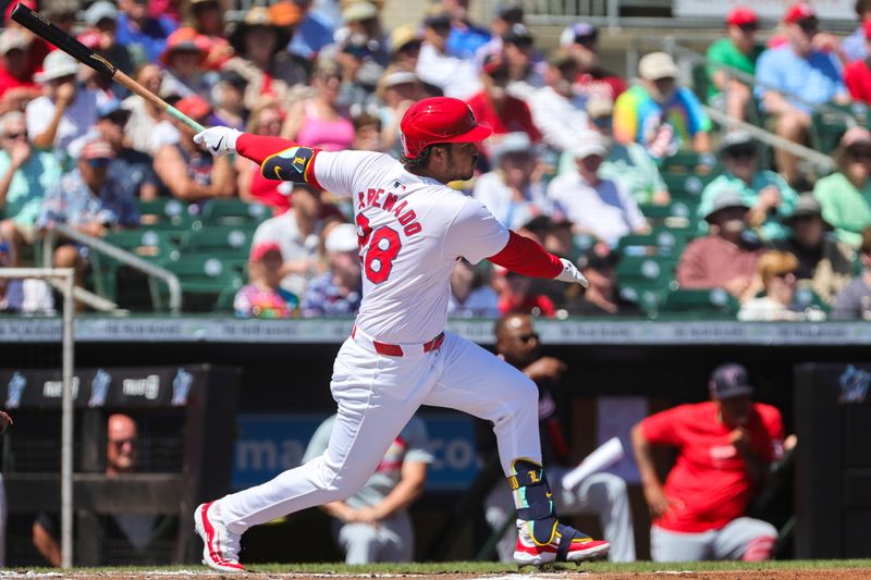 Mar 11, 2024; Jupiter, Florida, USA; St. Louis Cardinals designated hitter Nolan Arenado (28) hits a single against the Washington Nationals during the first inning at Roger Dean Chevrolet Stadium. Mandatory Credit: Sam Navarro-USA TODAY Sports