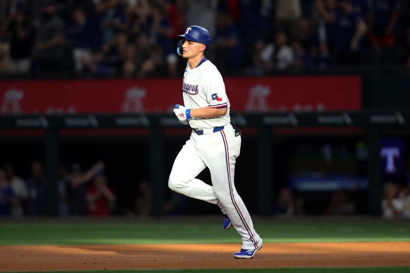 Aug 19, 2024; Arlington, Texas, USA;Texas Rangers shortstop Corey Seager (5) rounds the bases after hitting a home run against the Pittsburgh Pirates in the first inning at Globe Life Field. Mandatory Credit: Tim Heitman-USA TODAY Sports