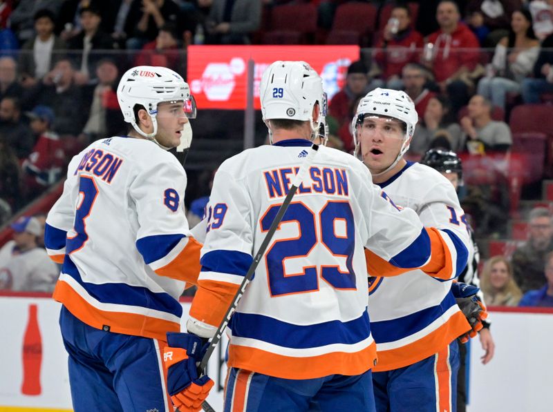 Jan 25, 2024; Montreal, Quebec, CAN; New York Islanders forward Bo Horvat (14) celebrates with teammates including forward Brock Nelson (29) after scoring a goal against the Montreal Canadiens during the second period at the Bell Centre. Mandatory Credit: Eric Bolte-USA TODAY Sports