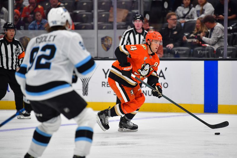 Oct 16, 2024; Anaheim, California, USA; Anaheim Ducks defenseman Cam Fowler (4) moves the puck against Utah Hockey Club during the second period at Honda Center. Mandatory Credit: Gary A. Vasquez-Imagn Images