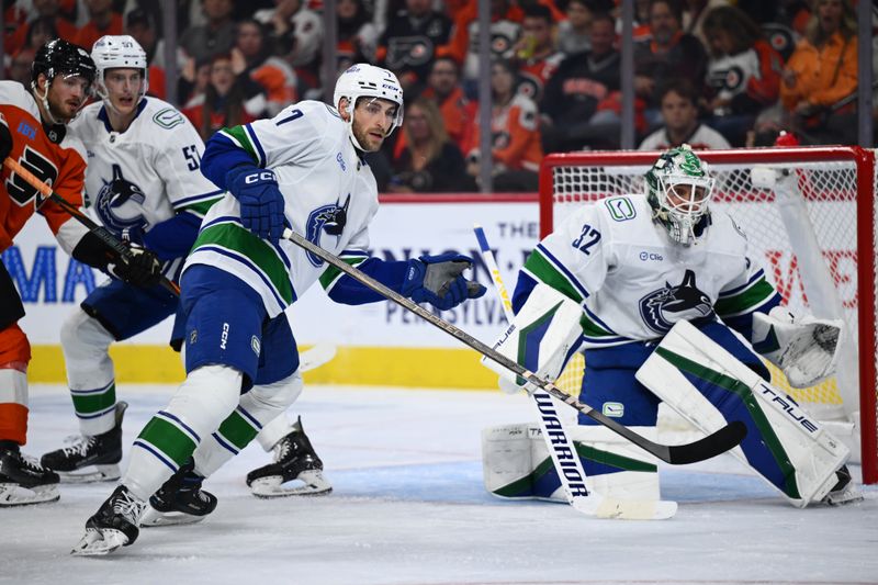Oct 19, 2024; Philadelphia, Pennsylvania, USA; Vancouver Canucks defenseman Carson Soucy (7) defends the net against the Philadelphia Flyers in the second period at Wells Fargo Center. Mandatory Credit: Kyle Ross-Imagn Images