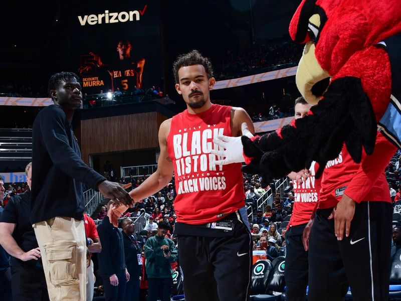 ATLANTA, GA - FEBRUARY 12: Trae Young #11 of the Atlanta Hawks walks on the court before the game on February 12, 2024 at State Farm Arena in Atlanta, Georgia.  NOTE TO USER: User expressly acknowledges and agrees that, by downloading and/or using this Photograph, user is consenting to the terms and conditions of the Getty Images License Agreement. Mandatory Copyright Notice: Copyright 2024 NBAE (Photo by Scott Cunningham/NBAE via Getty Images)