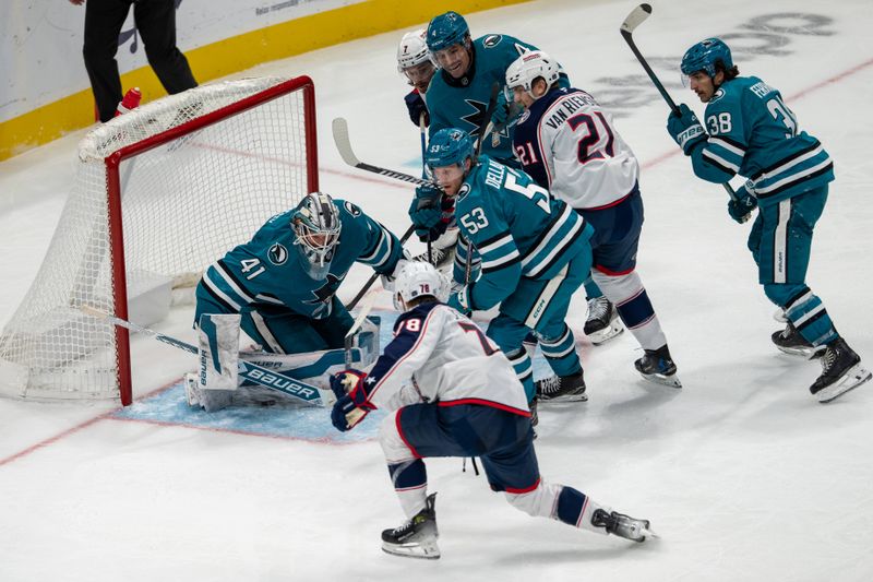 Nov 5, 2024; San Jose, California, USA;  San Jose Sharks goaltender Vitek Vanecek (41) makes a save against Columbus Blue Jackets defenseman Damon Severson (78) during the third period at SAP Center at San Jose. Mandatory Credit: Neville E. Guard-Imagn Images