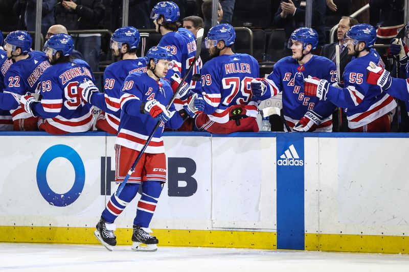 Apr 7, 2024; New York, New York, USA;  New York Rangers left wing Artemi Panarin (10) celebrates with his teammates after scoring a goal in the third period against the Montreal Canadiens at Madison Square Garden. Mandatory Credit: Wendell Cruz-USA TODAY Sports