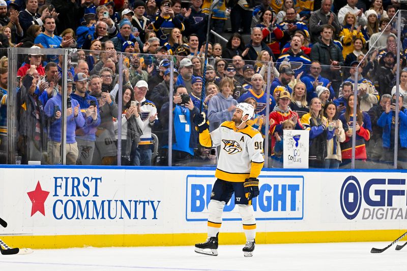 Nov 24, 2023; St. Louis, Missouri, USA;  Nashville Predators center Ryan O'Reilly (90) salutes the crowd as he is honored during his first game back during the first period against the St. Louis Blues at Enterprise Center. Mandatory Credit: Jeff Curry-USA TODAY Sports