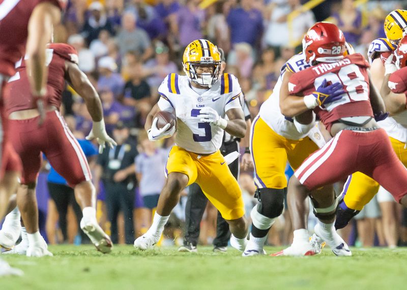 Sep 23, 2023; Baton Rouge, Louisiana, USA; LSU Tigers running back Logan Diggs (3) runs the ball during the game against the Arkansas Razorbacks at Tiger Stadium. Mandatory Credit: Scott Clause-USA TODAY Sports