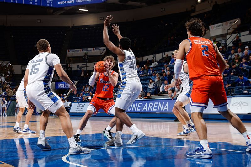 Jan 31, 2023; Colorado Springs, Colorado, USA; Boise State Broncos guard Max Rice (12) drives to the net against Air Force Falcons guard Marcell McCreary (42) and guard Corbin Green (15) as forward Tyson Degenhart (2) defends in the first half at Clune Arena. Mandatory Credit: Isaiah J. Downing-USA TODAY Sports