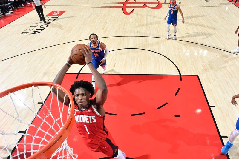 HOUSTON, TX - NOVEMBER 4: Amen Thompson #1 of the Houston Rockets dunks the ball during the game against the New York Knicks on November 4, 2024 at the Toyota Center in Houston, Texas. NOTE TO USER: User expressly acknowledges and agrees that, by downloading and or using this photograph, User is consenting to the terms and conditions of the Getty Images License Agreement. Mandatory Copyright Notice: Copyright 2024 NBAE (Photo by Logan Riely/NBAE via Getty Images)