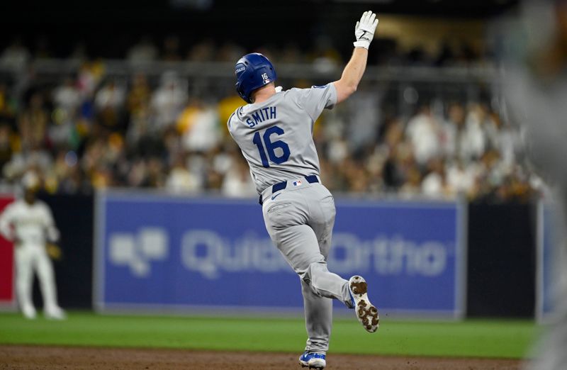 Oct 9, 2024; San Diego, California, USA; Los Angeles Dodgers catcher Will Smith (16) celebrates after hitting a two-run home run in the third inning against the San Diego Padres during game four of the NLDS for the 2024 MLB Playoffs at Petco Park.  Mandatory Credit: Denis Poroy-Imagn Images