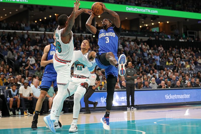 MEMPHIS, TENNESSEE - OCTOBER 26: Kentavious Caldwell-Pope #3 of the Orlando Magic handles the ball against Marcus Smart #36 of the Memphis Grizzlies \d1h at FedExForum on October 26, 2024 in Memphis, Tennessee. NOTE TO USER: User expressly acknowledges and agrees that, by downloading and or using this photograph, User is consenting to the terms and conditions of the Getty Images License Agreement. (Photo by Justin Ford/Getty Images)