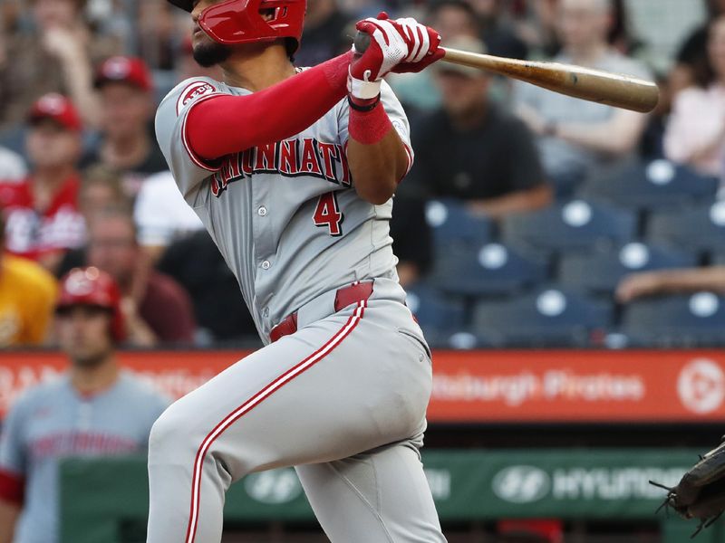 Jun 18, 2024; Pittsburgh, Pennsylvania, USA;  Cincinnati Reds third baseman Santiago Espinal (4) hits a two run home run against the Pittsburgh Pirates during the fifth inning at PNC Park. Mandatory Credit: Charles LeClaire-USA TODAY Sports