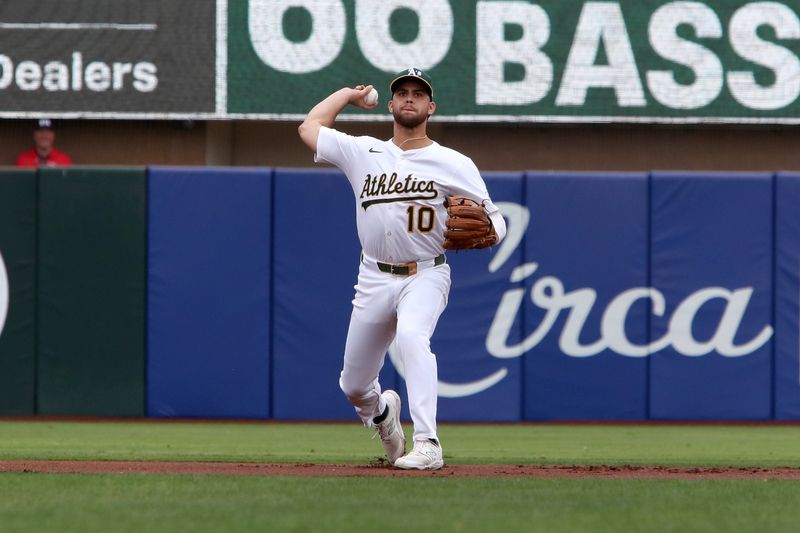 Sep 28, 2025; West Sacramento, California, USA; Athletics shortstop Max Muncy (10) throws to first base for an out against the Kansas City Royals during the first inning at Sutter Health Park. Mandatory Credit: Dennis Lee-Imagn Images