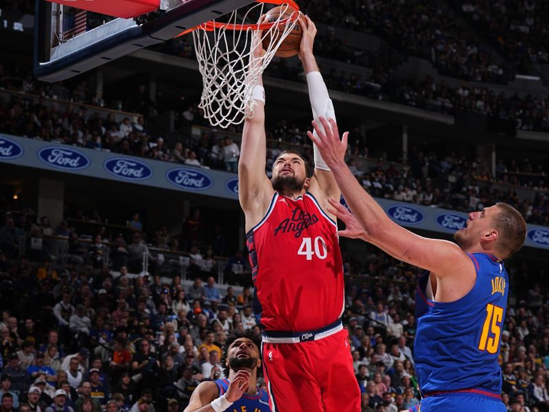 DENVER, CO - APRIL 19: Ivica Zubac #40 of the LA Clippers drives to the basket during the game against the Denver Nuggets during Round One Game One of the 2025 NBA Playoffs on April 19, 2025 at Ball Arena in Denver, Colorado. NOTE TO USER: User expressly acknowledges and agrees that, by downloading and/or using this Photograph, user is consenting to the terms and conditions of the Getty Images License Agreement. Mandatory Copyright Notice: Copyright 2025 NBAE (Photo by Garrett Ellwood/NBAE via Getty Images)