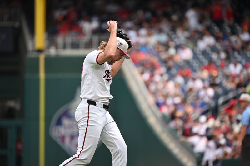 Jul 4, 2024; Washington, District of Columbia, USA; Washington Nationals starting pitcher Jake Irvin (27) reacts after a strikeout to end the 8th inning against the New York Mets at Nationals Park. Mandatory Credit: Rafael Suanes-USA TODAY Sports