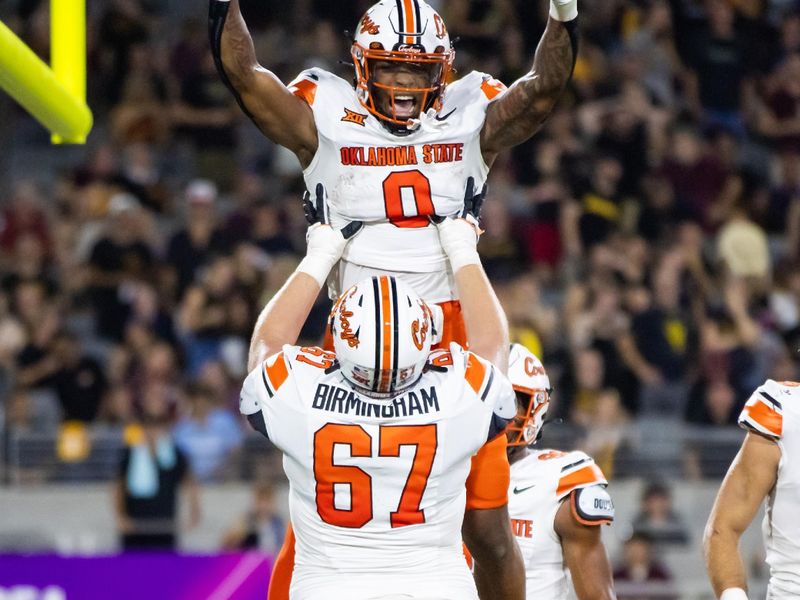 Sep 9, 2023; Tempe, Arizona, USA; Oklahoma State Cowboys running back Ollie Gordon II (0) celebrates a touchdown with offensive lineman Cole Birmingham (67) against the Arizona State Sun Devils in the first half at Mountain America Stadium. Mandatory Credit: Mark J. Rebilas-USA TODAY Sports