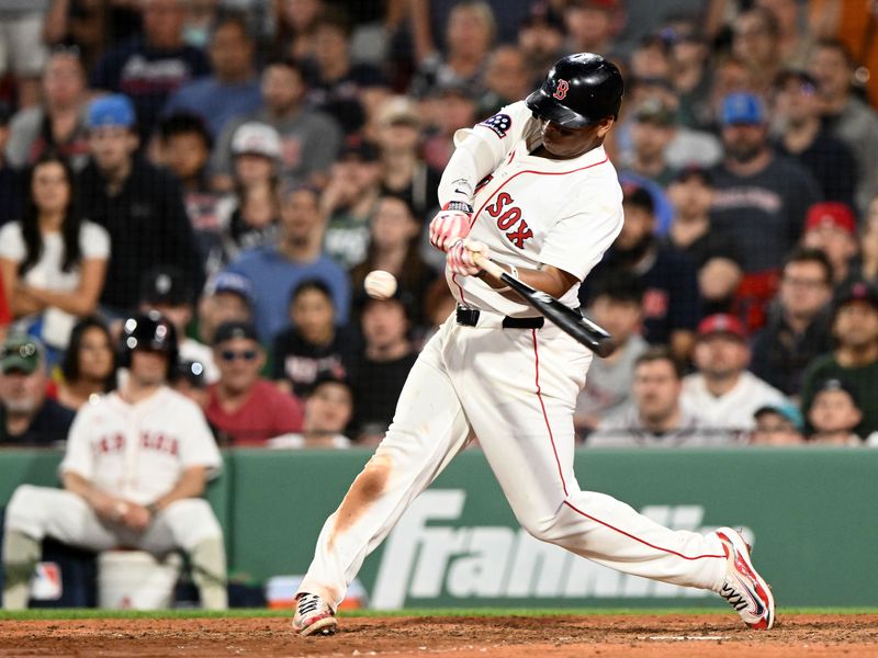 May 17, 2025; Boston, Massachusetts, USA; Boston Red Sox designated hitter Rafael Devers (11) hits a walk off home run against the Atlanta Braves during the ninth inning at Fenway Park. Mandatory Credit: Brian Fluharty-Imagn Images