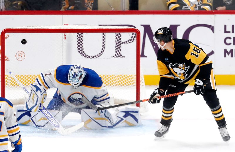 Oct 16, 2024; Pittsburgh, Pennsylvania, USA; Pittsburgh Penguins right wing Jesse Puljujarvi (18) scores a goal against Buffalo Sabres goaltender Ukko-Pekka Luukkonen (1) during the second period at PPG Paints Arena. Mandatory Credit: Charles LeClaire-Imagn Images