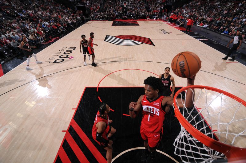 PORTLAND, OR - APRIL 12: Amen Thompson #1 of the Houston Rockets goes up for the rebound during the game against the Portland Trail Blazers on April 12, 2024 at the Moda Center Arena in Portland, Oregon. NOTE TO USER: User expressly acknowledges and agrees that, by downloading and or using this photograph, user is consenting to the terms and conditions of the Getty Images License Agreement. Mandatory Copyright Notice: Copyright 2024 NBAE (Photo by Cameron Browne/NBAE via Getty Images)