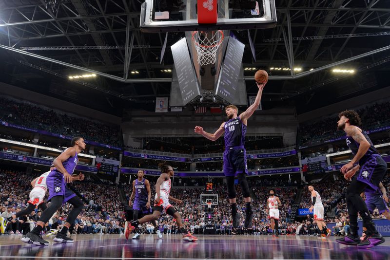 SACRAMENTO, CA - MARCH 4: Domantas Sabonis #10 of the Sacramento Kings rebounds the ball during the game against the Chicago Bulls on March 4, 2024 at Golden 1 Center in Sacramento, California. NOTE TO USER: User expressly acknowledges and agrees that, by downloading and or using this Photograph, user is consenting to the terms and conditions of the Getty Images License Agreement. Mandatory Copyright Notice: Copyright 2024 NBAE (Photo by Rocky Widner/NBAE via Getty Images)