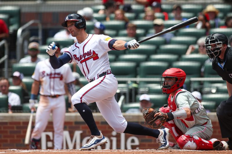 Jul 7, 2024; Atlanta, Georgia, USA; Atlanta Braves left fielder Eli White (36) hits a single against the Philadelphia Phillies in the second inning at Truist Park. Mandatory Credit: Brett Davis-USA TODAY Sports
