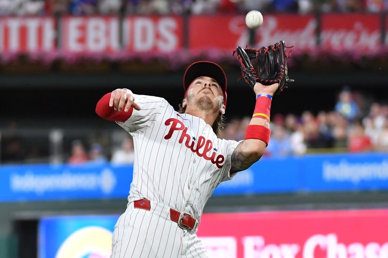 Jun 17, 2024; Philadelphia, Pennsylvania, USA; Philadelphia Phillies second base Bryson Stott (5) catches pop fly during the seventh inning against the San Diego Padres at Citizens Bank Park. Mandatory Credit: Eric Hartline-USA TODAY Sports