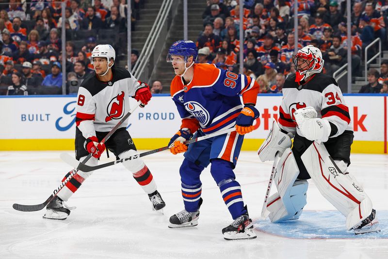 Nov 4, 2024; Edmonton, Alberta, CAN; Edmonton Oilers forward Corey Perry (90) tries to screen New Jersey Devils goaltender Jake Allen (34) during the third period at Rogers Place. Mandatory Credit: Perry Nelson-Imagn Images