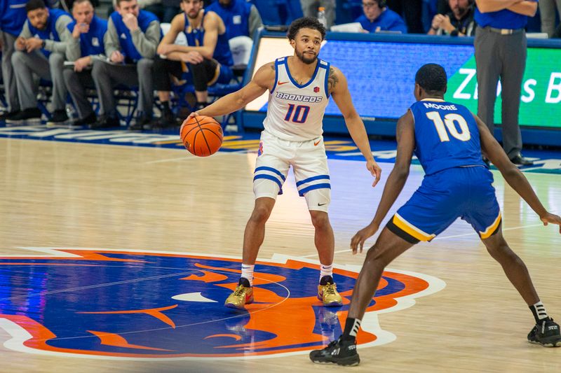 Jan 3, 2023; Boise, Idaho, USA; Boise State Broncos guard Marcus Shaver Jr. (10) dribbles the ball during the second half versus the San Jose State Spartans at ExtraMile Arena. Mandatory Credit: Brian Losness-USA TODAY Sports

