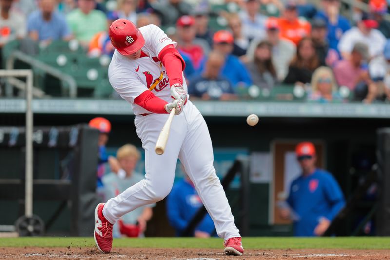 Feb 24, 2025; Jupiter, Florida, USA; St. Louis Cardinals first baseman Luken Baker (26) hits a three-run home run against the New York Mets during the second inning at Roger Dean Chevrolet Stadium. Mandatory Credit: Sam Navarro-Imagn Images