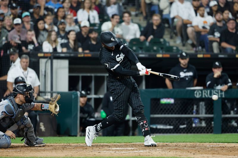 Jun 9, 2023; Chicago, Illinois, USA; Chicago White Sox center fielder Luis Robert Jr. (88) hits a walk-off single against the Miami Marlins during the ninth inning at Guaranteed Rate Field. Mandatory Credit: Kamil Krzaczynski-USA TODAY Sports