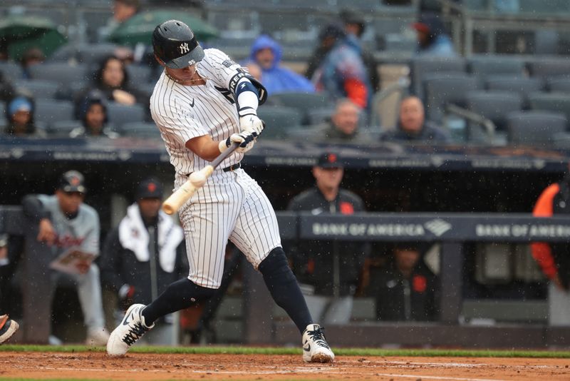 May 5, 2024; Bronx, New York, USA; New York Yankees third baseman Oswaldo Cabrera (95) hits an RBI double during the second inning against the Detroit Tigers at Yankee Stadium. Mandatory Credit: Vincent Carchietta-USA TODAY Sports