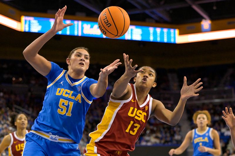 Dec 30, 2023; Los Angeles, California, USA; UCLA Bruins center Lauren Betts (51) and USC Trojans center Rayah Marshall (13) reach for a rebound in the second half at Pauley Pavilion presented by Wescom. Mandatory Credit: Jayne Kamin-Oncea-USA TODAY Sports