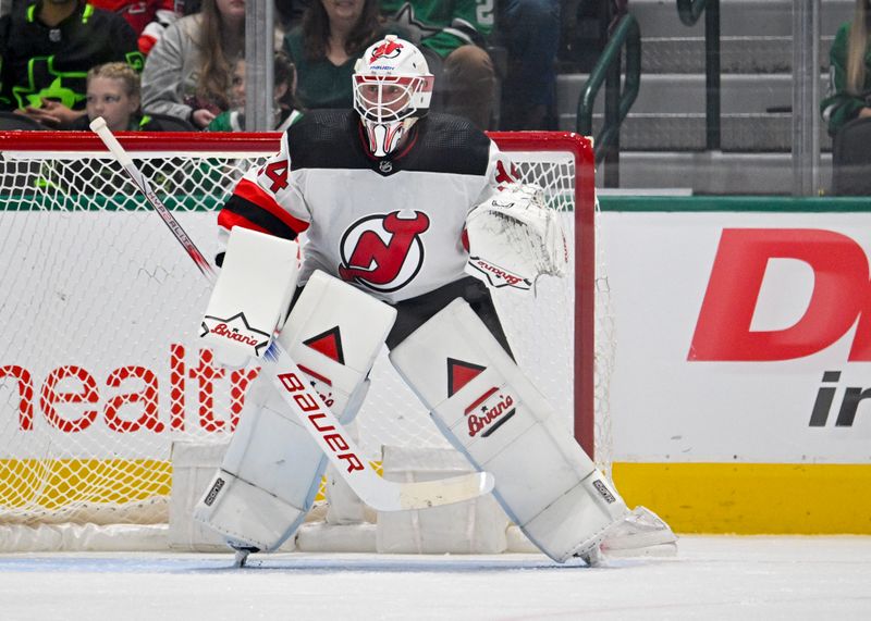 Mar 14, 2024; Dallas, Texas, USA; New Jersey Devils goaltender Jake Allen (34) faces the Dallas Stars attack during the first period at the American Airlines Center. Mandatory Credit: Jerome Miron-USA TODAY Sports