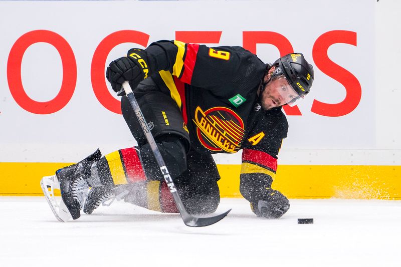 Mar 19, 2024; Vancouver, British Columbia, CAN; Vancouver Canucks forward J.T. Miller (9) blocks a clearing attempt against the Buffalo Sabres in the third period at Rogers Arena. Vancouver won 3 -2. Mandatory Credit: Bob Frid-USA TODAY Sports