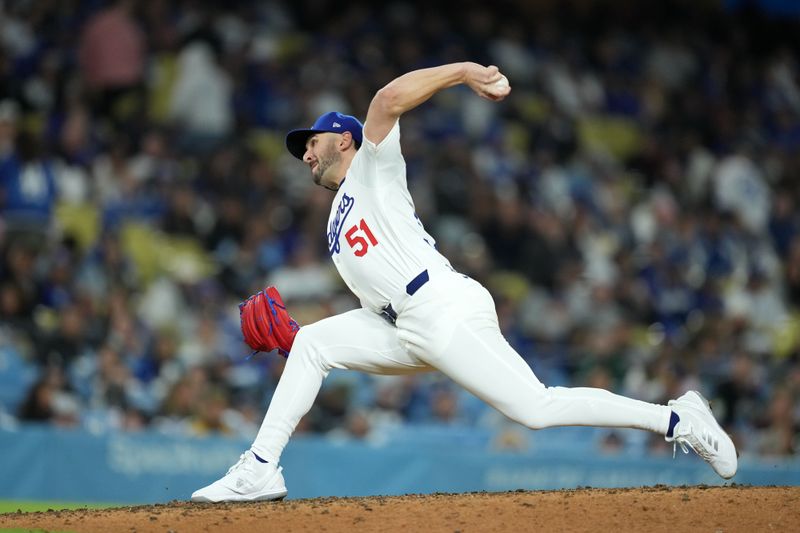 Apr 12, 2024; Los Angeles, California, USA; Los Angeles Dodgers pitcher Alex Vesia (51) throws in the 11th inning against the San Diego Padres at Dodger Stadium. Mandatory Credit: Kirby Lee-USA TODAY Sports