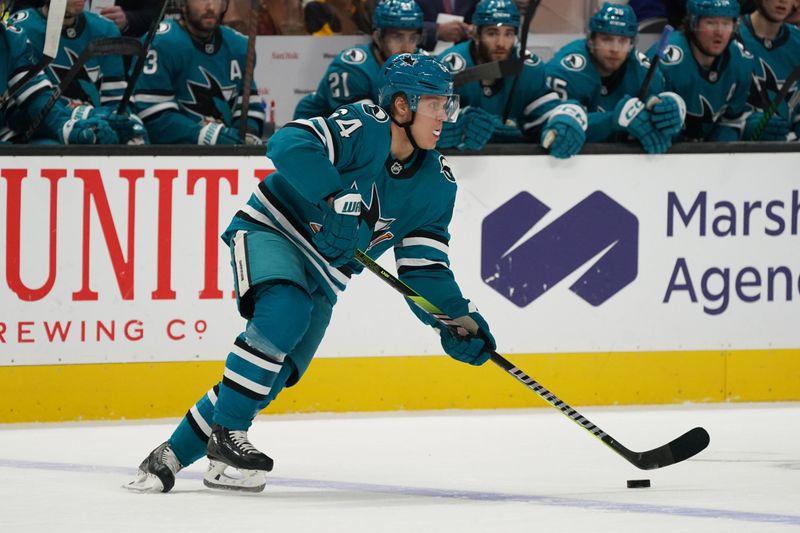 Jan 27, 2025; San Jose, California, USA;  San Jose Sharks center Mikael Granlund (64) looks to pass the puck in the first period against the Pittsburgh Penguins at SAP Center at San Jose. Mandatory Credit: David Gonzales-Imagn Images