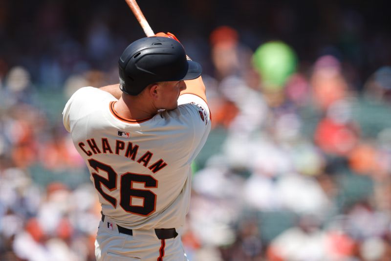 Jul 11, 2024; San Francisco, California, USA; San Francisco Giants third base Matt Chapman (26) hits a single during the sixth inning against the Toronto Blue Jays at Oracle Park. Mandatory Credit: Sergio Estrada-USA TODAY Sports