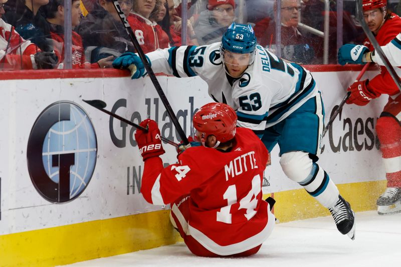 Jan 14, 2025; Detroit, Michigan, USA;  San Jose Sharks center Ty Dellandrea (53) checks Detroit Red Wings center Tyler Motte (14) in the first period at Little Caesars Arena. Mandatory Credit: Rick Osentoski-Imagn Images